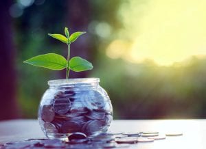 Jar Filled With Money For Saving And Investing