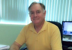 Ron Hart at his desk in the office