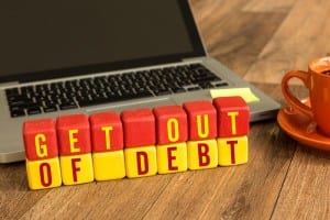 Get out of debt sign in front of computer