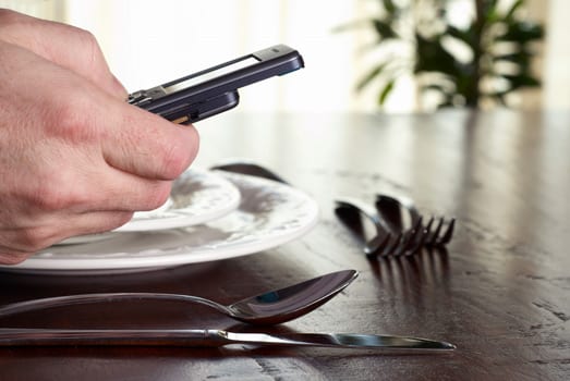 Using a cellphone at the table