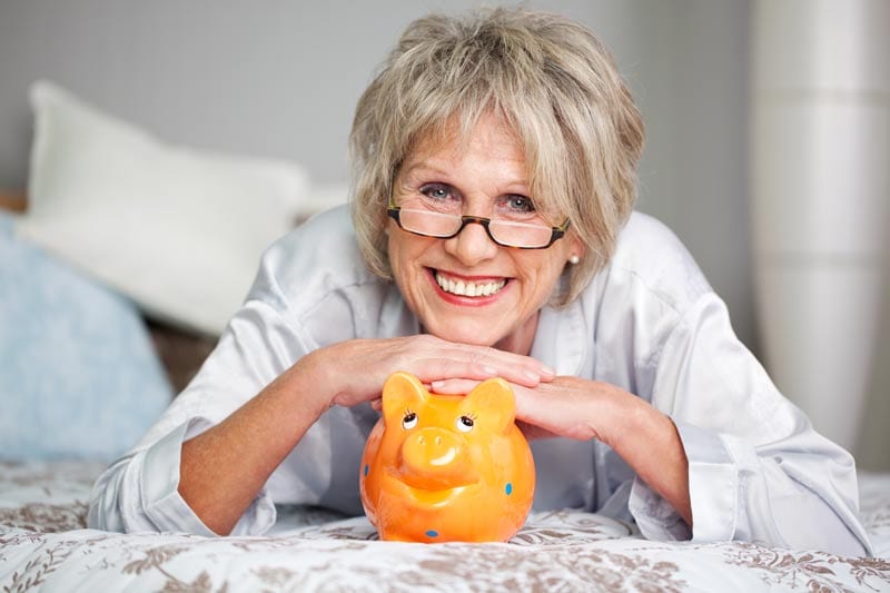 Senior Women with piggy bank