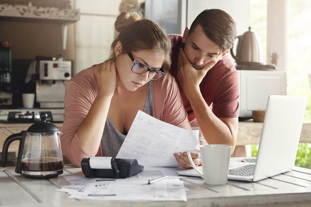 couple evaluating bills