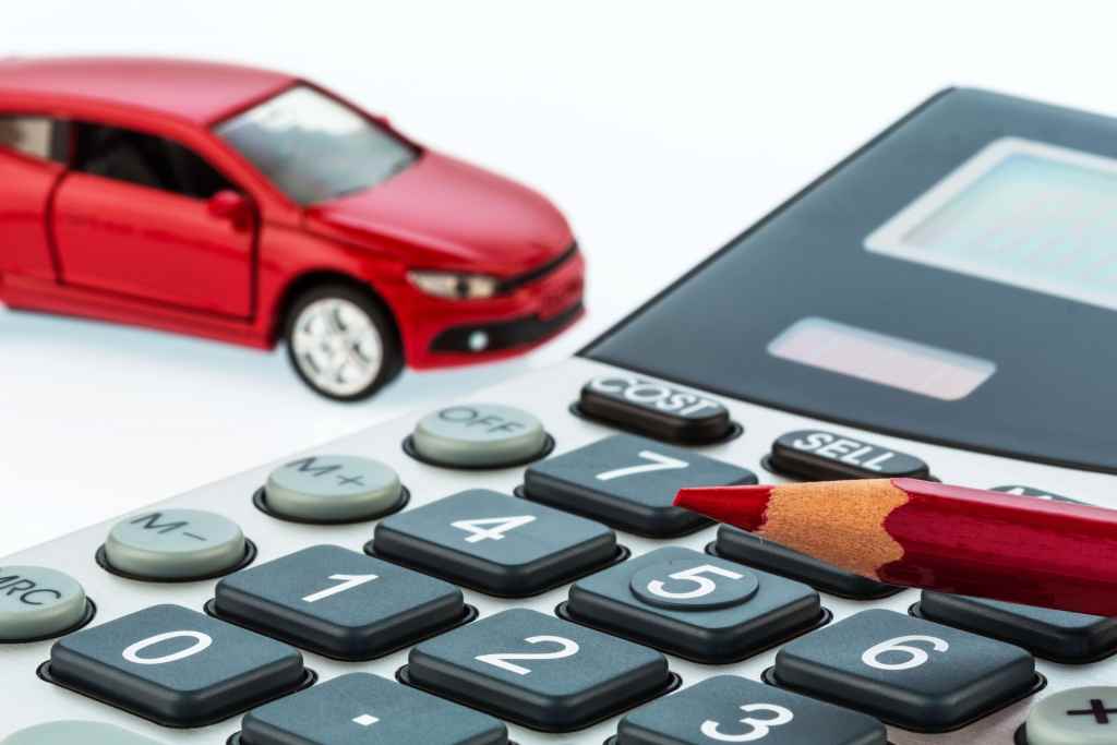 Calculator with a car in the background (2) Calculator with a car in the background (2)