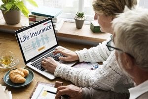 Couple contemplating borrowing from life insurance policy