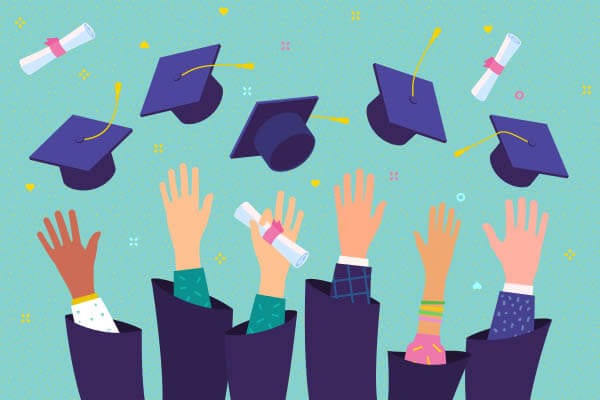 College graduates throwing their caps in the air