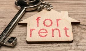 House keychain labeled for rent attached to key to home