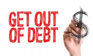 Hand with marker writing the word Get Out of Debt