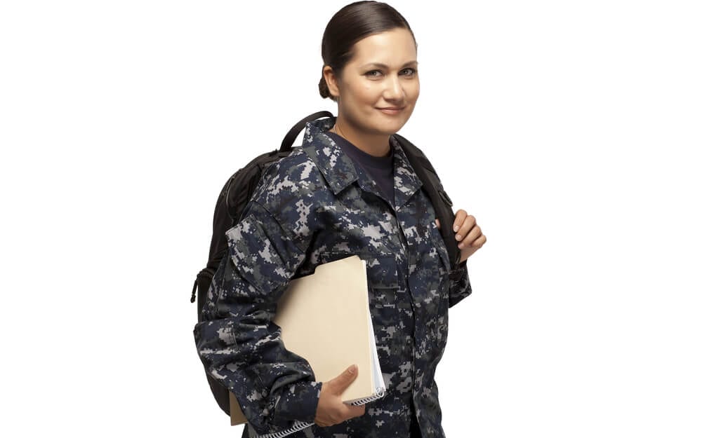 Female soldier with uniform and backpack on with papers in hand