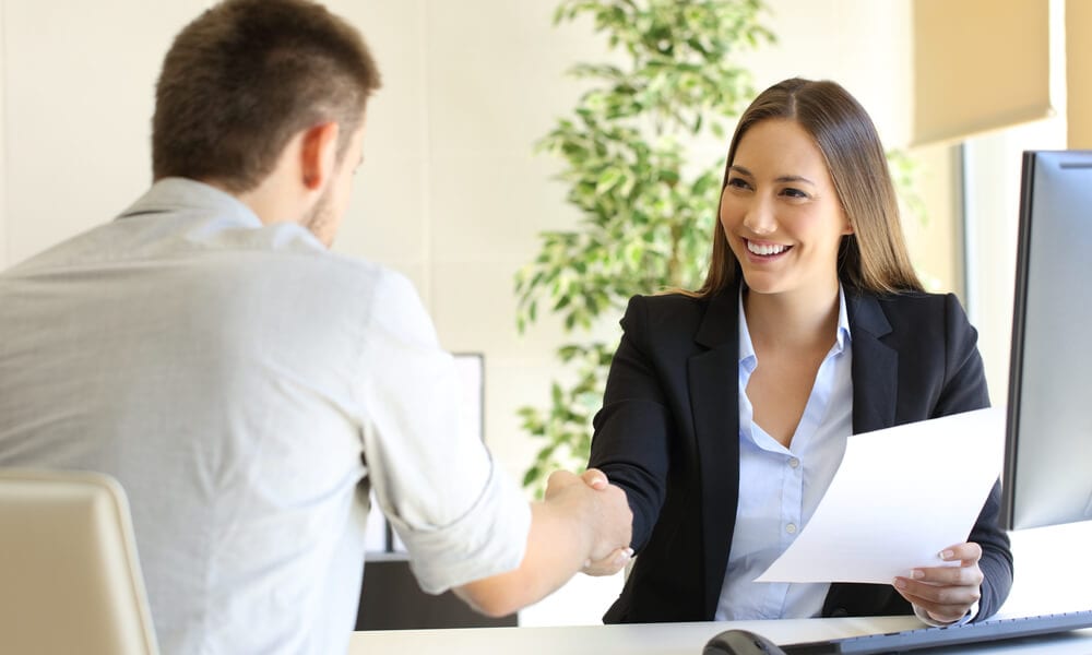 Job interviewer shaking hands with potential employee
