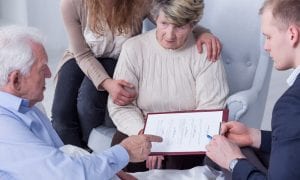 Family gathered around father while revising last will