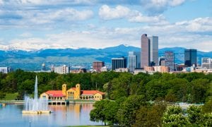 Denver Colorado downtown with City Park, tall buildings and mountains in background