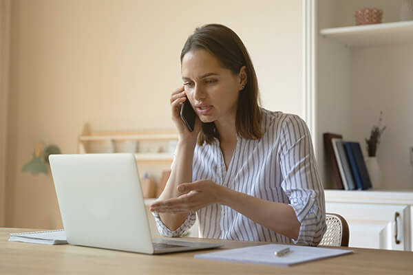 Canceling Subscription Services Woman on the phone trying to cancel her subscription services