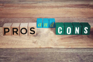 Pros and cons blocks on a wooden desk