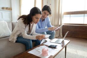 Couple discussing whether or not to do a balance transfer or personal loan