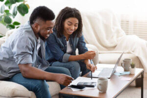 Couple sitting down to do their household budget