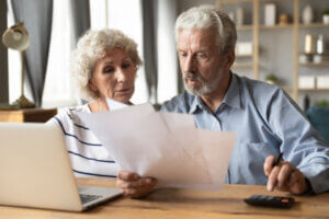 Senior citizen couple with bad credit researching their loan options