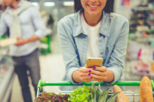 Young college woman shopping for groceries