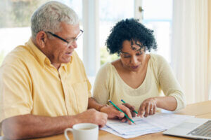 Senior couple discussing using their retirement to pay off debt