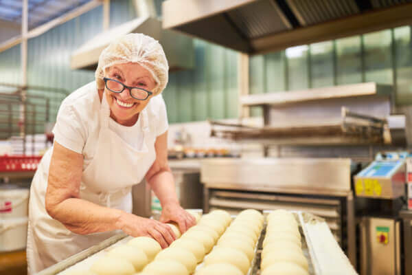 Senior woman working at a bakery