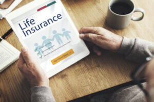 Man researching life insurance options at the dining table