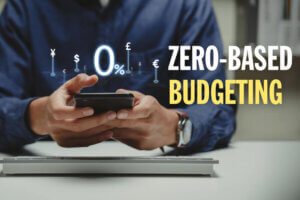 Man with calculator doing Zero-Based Budgeting