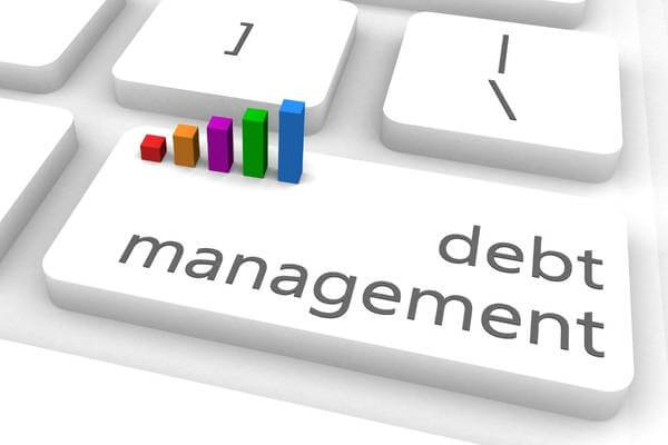 Illustration of keyboard with words Debt Management on it.