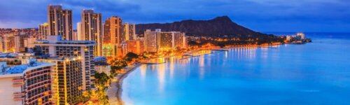 Skyline of Honolulu, Diamond Head volcano including the hotels and buildings on Waikiki Beach.